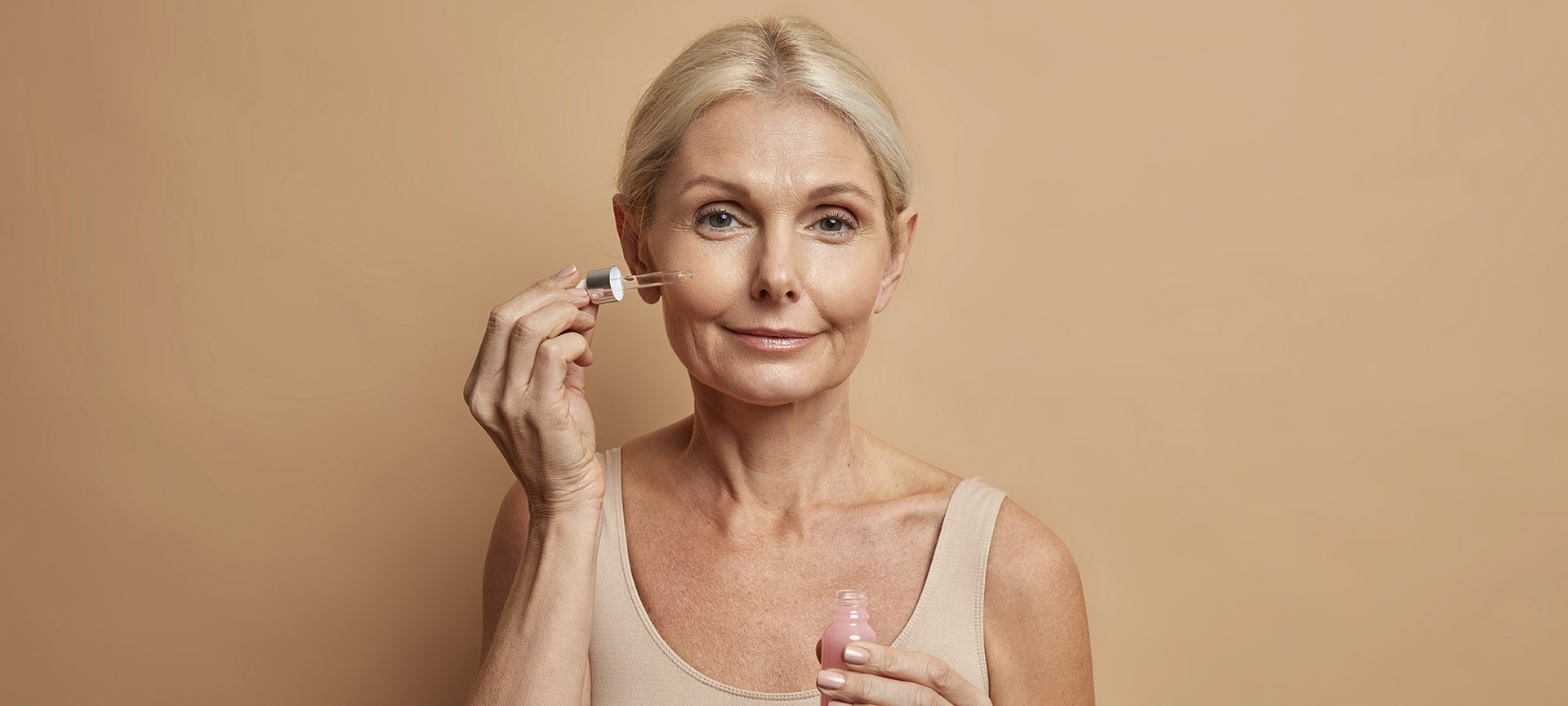 Woman Applies Retinol Face